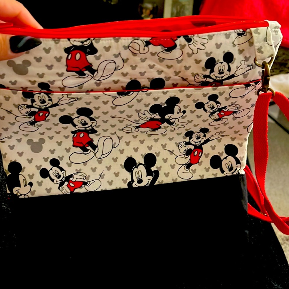 Mickey Mouse with zipper in front  with two pockets never been used